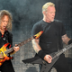 Kirk Hammett and James Hetfield aren't urinating in this picture, but let's just pretend they are. (Photo: Kevin Winter/Getty)
